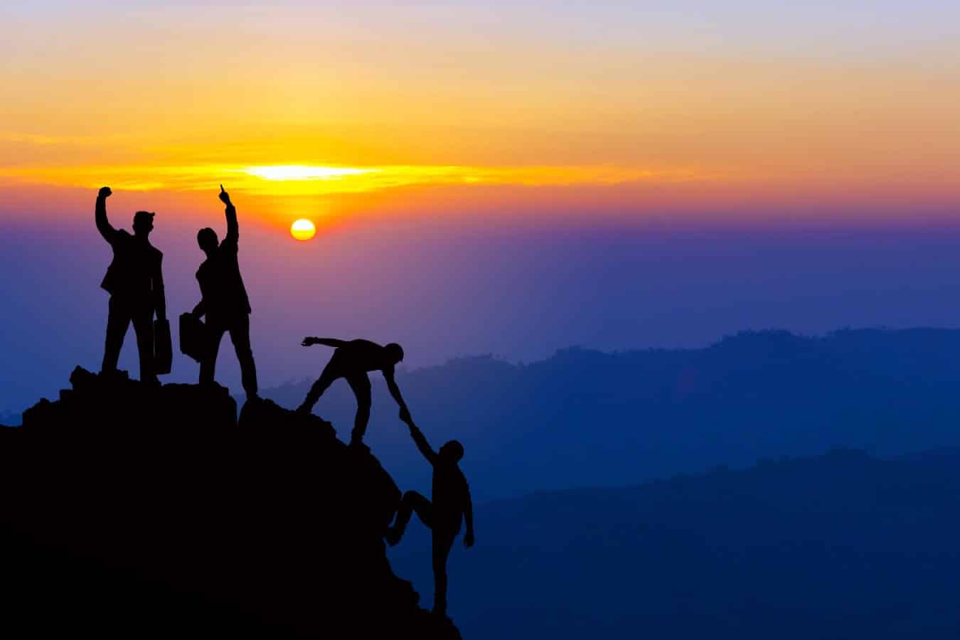 A Group of People Climbing a Mountain