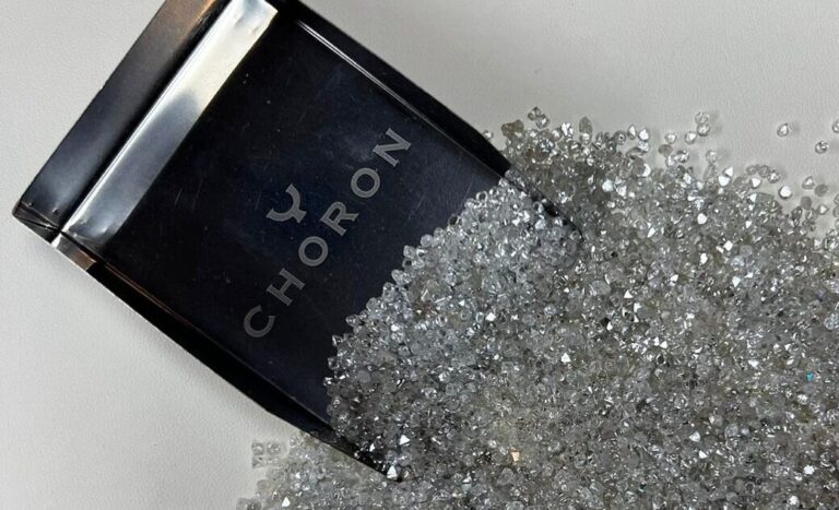A Pile of Polished Diamonds and a Choron Jewelry Box